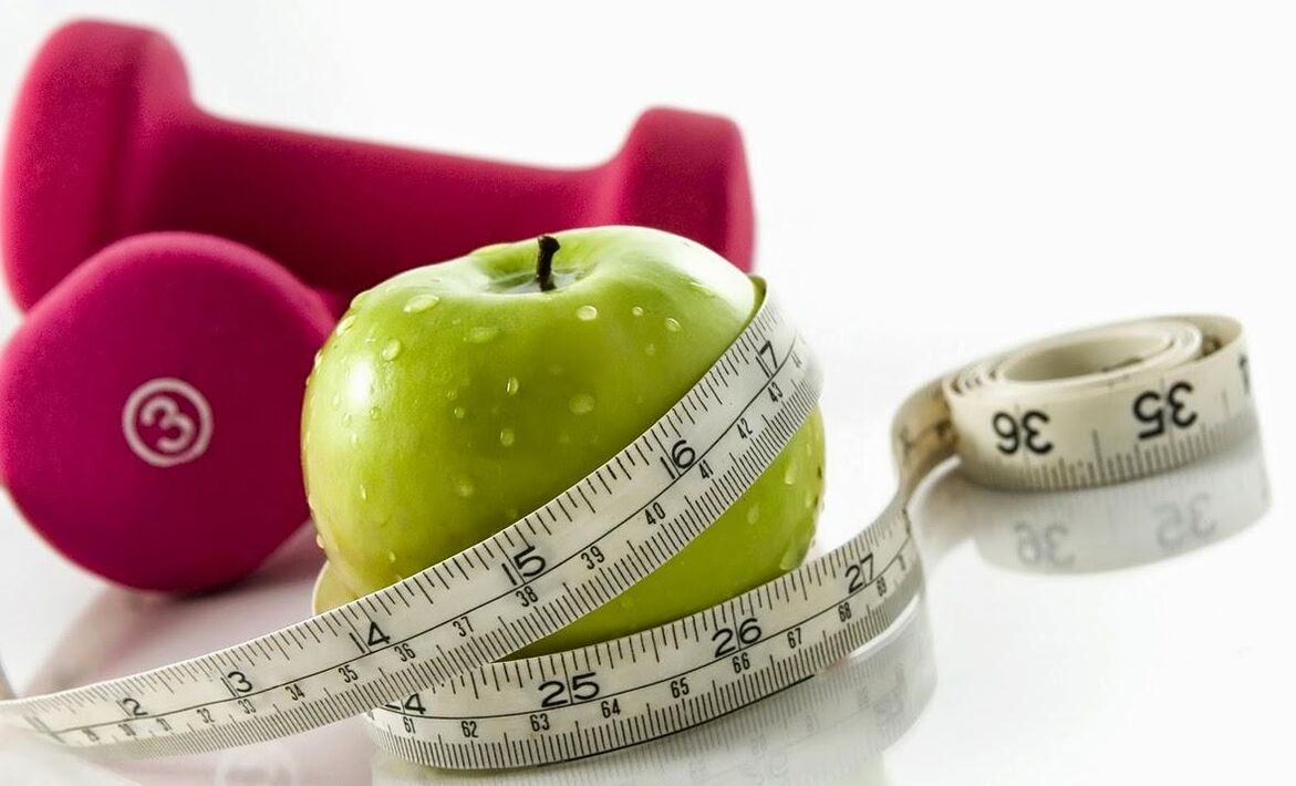 Pomme et haltères pour perdre du poids de 10 kg par mois